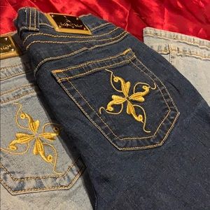 2 pairs of baby phat bootcut/wide-leg jeans